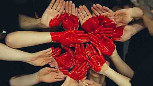 Hands with a red heart