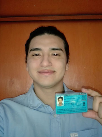 Correct image - Forward-facing photo, clear and holding an ID document